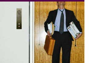 Overworked Man in Elevator